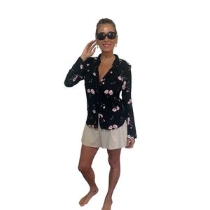 Button down ladies black and pink rose collared shirt.